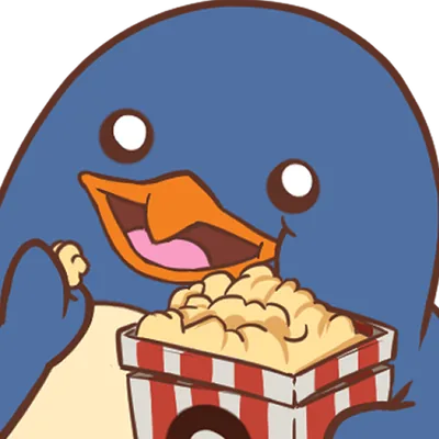 Le pingouin mange du pop-corn en regardant le spectacle.